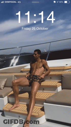Phone Screen Shirtless Man On Boat 11:14 GIF
