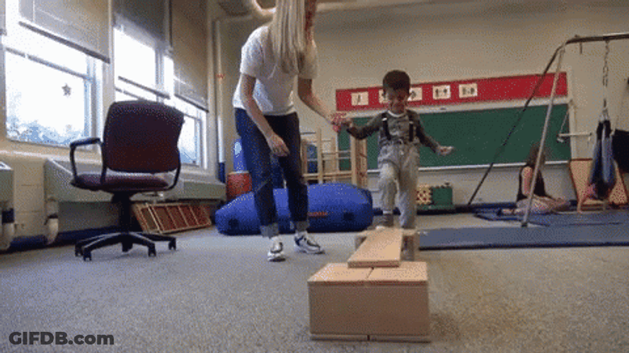 Physical Therapist With A Young Patient GIF