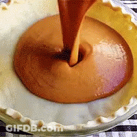 Pie Crust Being Filled With Caramel Sauce GIF
