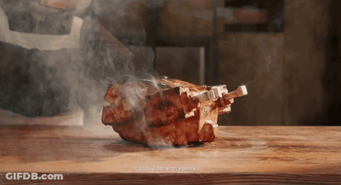 Piece Of Meat Cooking On Wooden Cutting Board With Smoke GIF