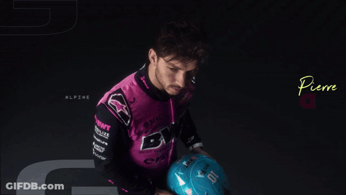 Pierre Gasly Is Holding A Blue Helmet In His Hands GIF
