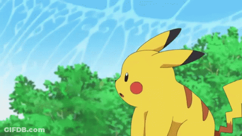 Pikachu Sitting In Grass Looking Up GIF