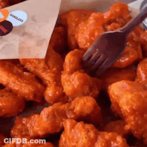 Pile Of Chicken Nuggets With Fork GIF