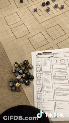 Pile Of Dice Beside Paper Saying Beyond GIF