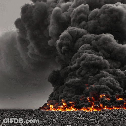 Pile Of Old Tires Burning In Field GIF