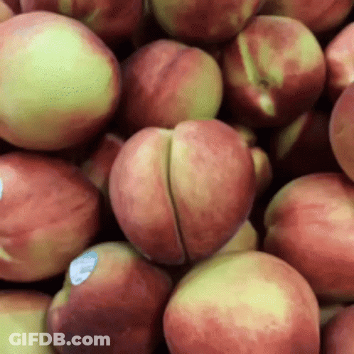 Pile Of Peaches With Blue Label GIF