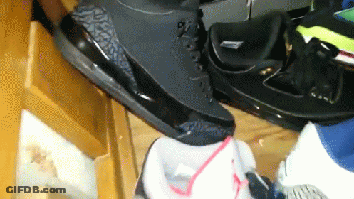 Pile Of Shoes On Table GIF