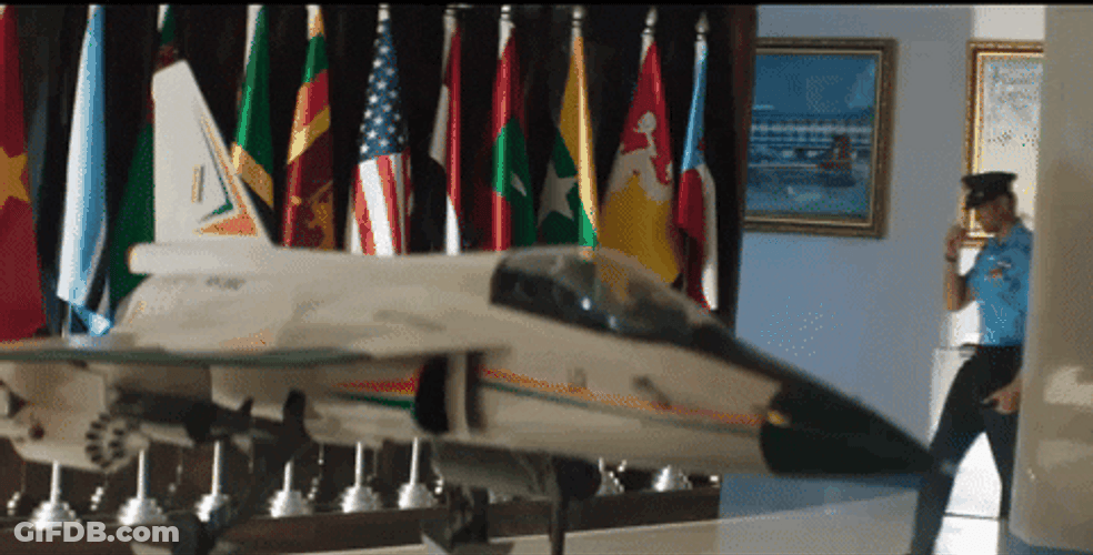 Pilot Passes Through Fighter Jet Figurine GIF