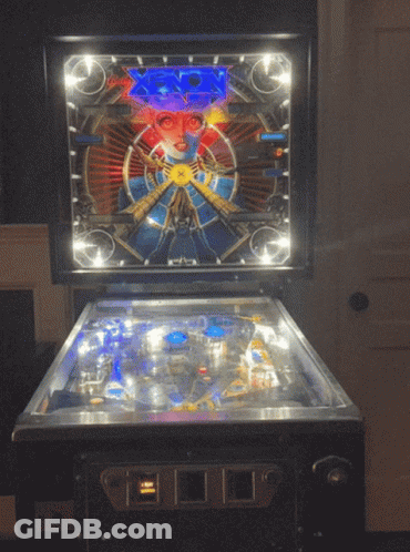 Pinball Machine With Face And Number 0 GIF