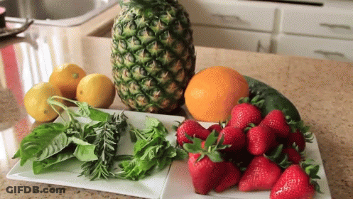 Pineapple Next To Strawberries Lemons And Other Fruits GIF
