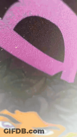 Pink And Black Item With Face GIF