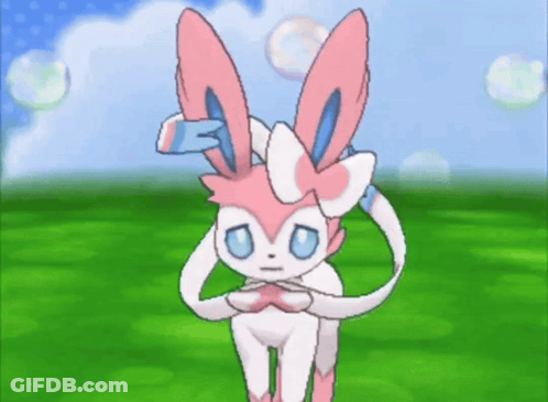 Pink And White Rabbit With Blue Eyes Standing In Field GIF
