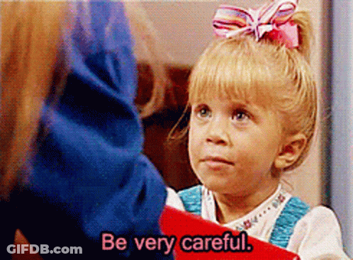 Pink-Bow Girl Holds Red Book Says Be Careful GIF