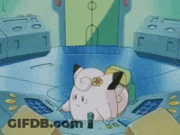 Pink Cartoon Character Sitting On Table With Yellow Flower GIF