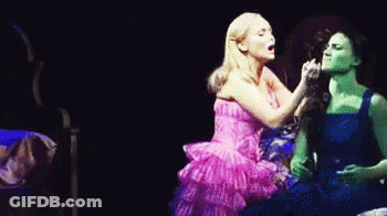 Pink Dress Woman Next To Blue Dress Woman GIF