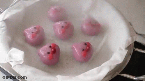 Pink Face Balls Sitting In A Pan GIF