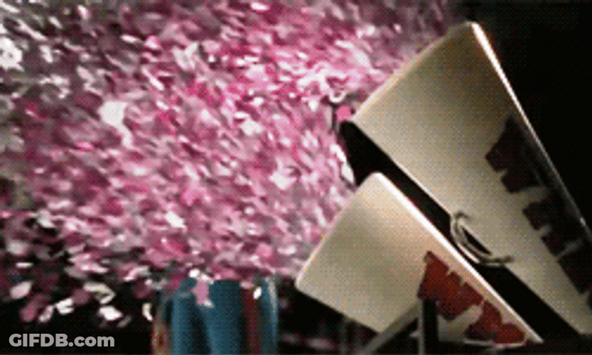 Pink Falling Confetti On Stage GIF