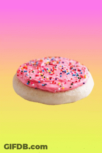 Pink Frosting Cookie With Colorful Sprinkles GIF