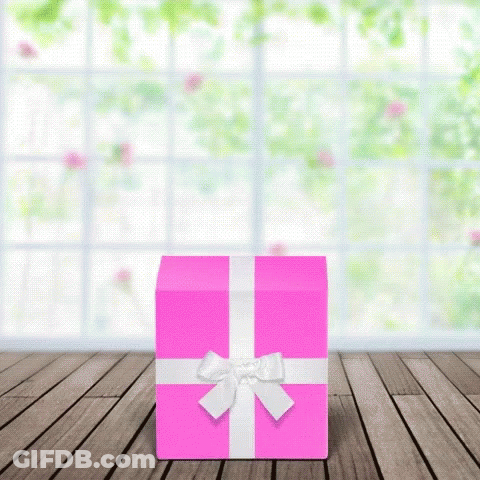 Pink Gift Box With White Bow On Wooden Floor GIF