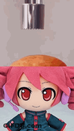 Pink Hair Stuffed Doll Next To Bottle GIF