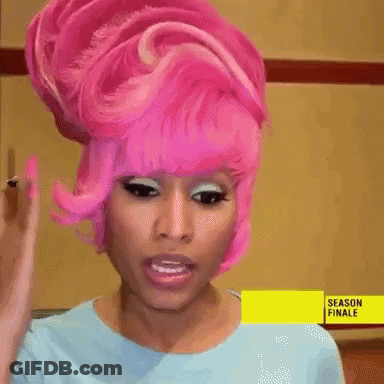 Pink Hair Woman In Blue Shirt With Season Finale Sign GIF