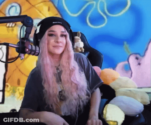 Pink-Haired Girl At Mic With SpongeBob Background GIF