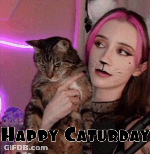 Pink-Haired Girl Holding Cat With Cat-Face Paint GIF