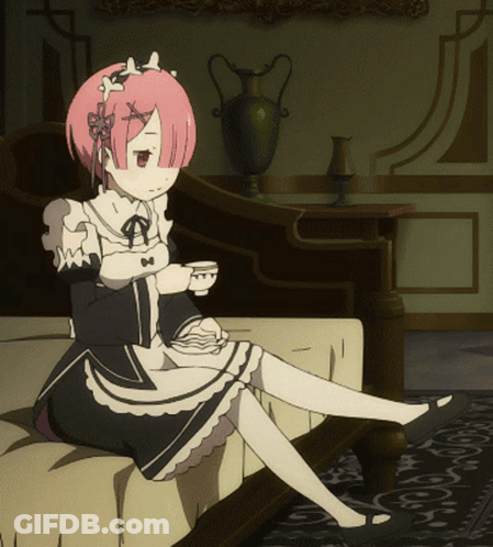 Pink Haired Girl Sitting On Couch Holding Tea GIF