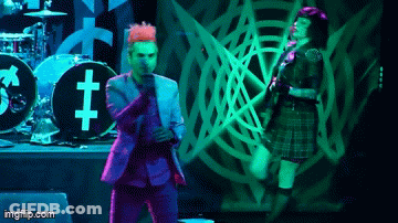 Pink-Haired Man Playing Guitar By Akai Rack GIF