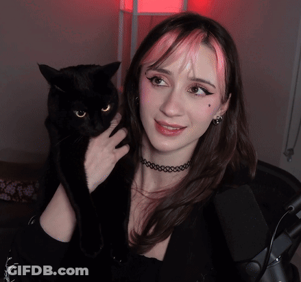 Pink Haired Woman Holding Black Cat GIF