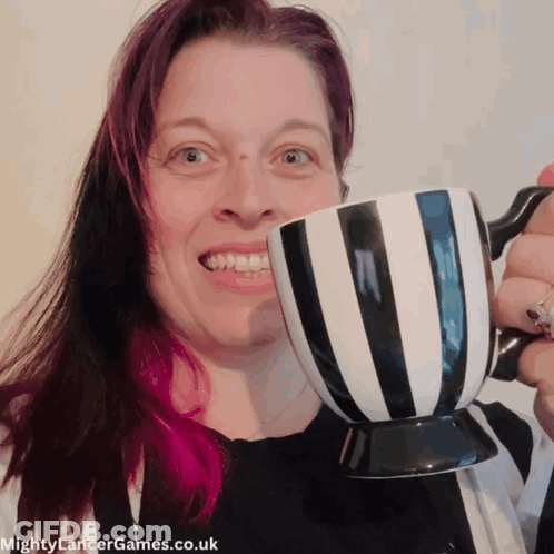 Pink Haired Woman Holding Striped Coffee Cup GIF