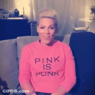Pink Haired Woman In Pink Dress Making Funny Face GIF