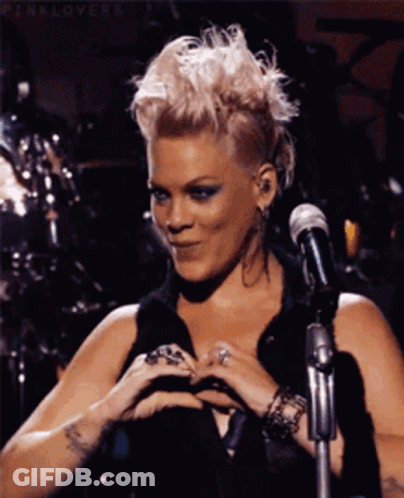 Pink Haired Woman Making Heart At Mic GIF