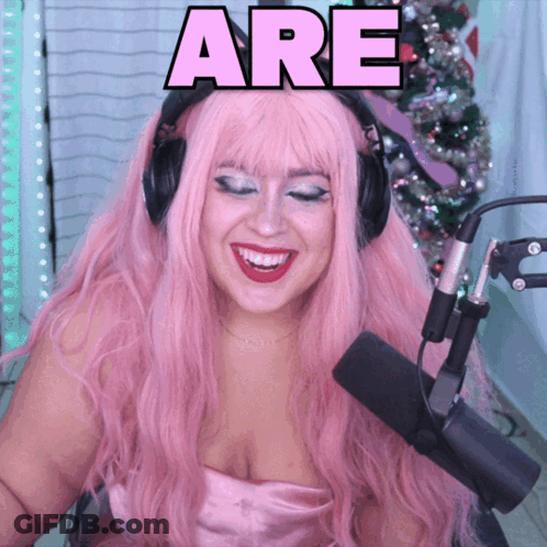 Pink Haired Woman Smiling At Microphone Saying Are GIF