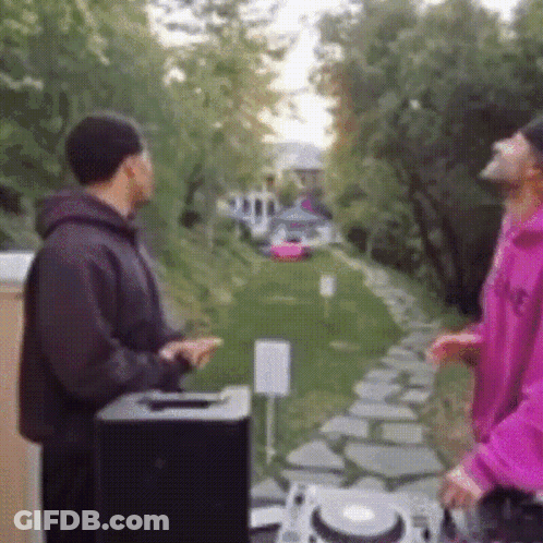 Pink Hoodie Man Next To Black Jacket Man GIF