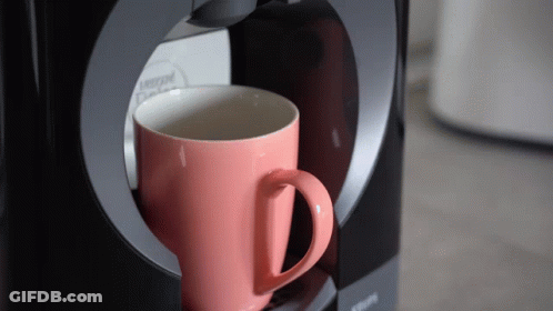 Pink Nescafe Cup Being Poured Into Krups Coffee Maker GIF