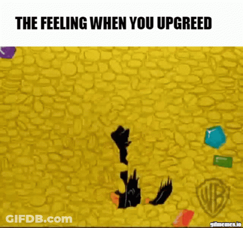 Pink Octopus Wearing Sunglasses In Gold Pile GIF