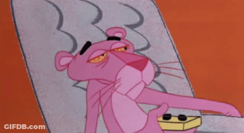 Pink Panther Lying On Bed GIF