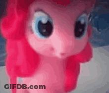 Pink Pony Doll With Big Eyes And Pink Hair GIF