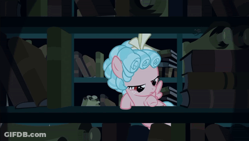 Pink Pony With Blue Hair Sitting On Shelf GIF