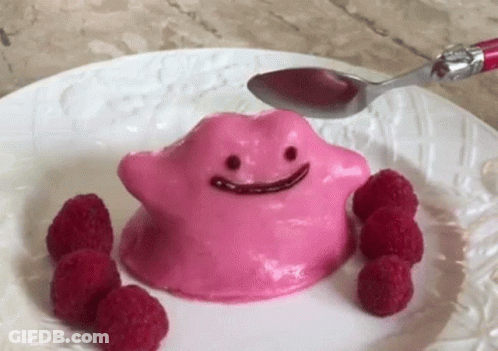Pink Pudding With Face And Raspberries And Spoon GIF