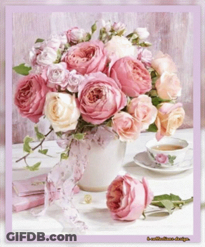 Pink Rose Bouquet Next To Tea Cup GIF