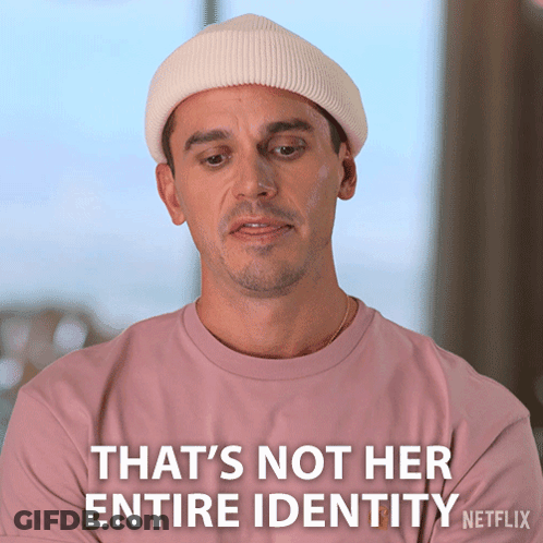 Pink-Shirt White-Hat Man That's Not Her Entire Identity GIF