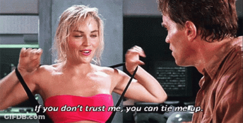 Pink Top Woman Talking To Brown Shirt Man GIF