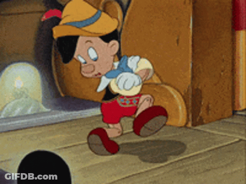 Pinocchio Standing In Front Of Fireplace GIF