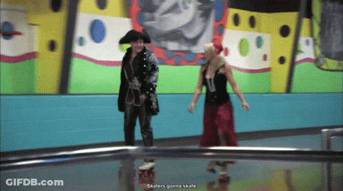 Pirate And Woman In Red Dress Rollerblading GIF