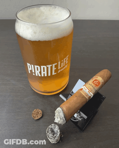 Pirate Life Beer Glass Next To Cigar GIF