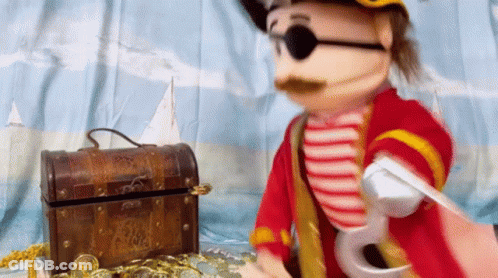 Pirate Puppet Next To Treasure Chest GIF