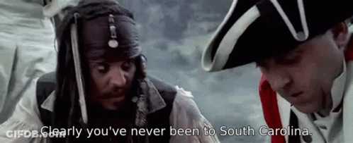 Pirate Standing Next To Man In Military Uniform Talking GIF