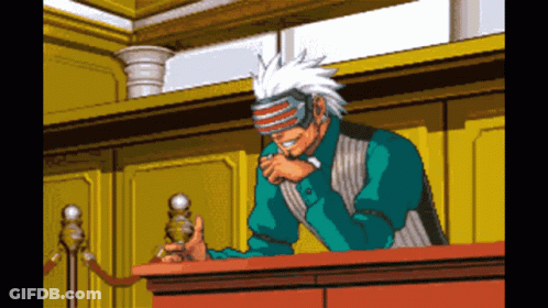 Pixel Art Man Wearing Mask Sitting At Table GIF
